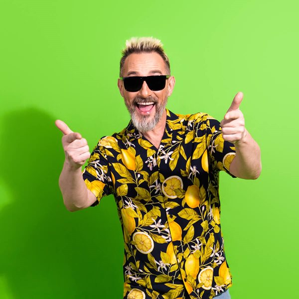Happy man in colorful shirt pointing