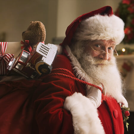 Santa con una bolsa llena de juguetes.