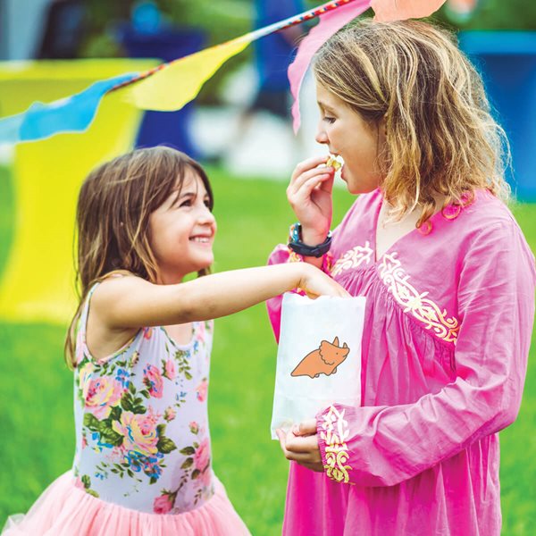 two girls eating popcorn