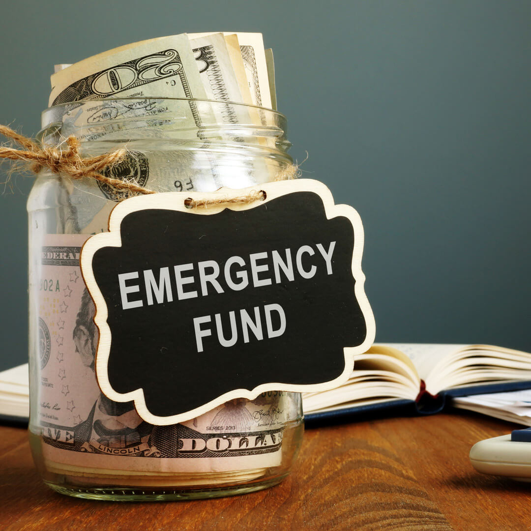 Emergency fund jar with money in it.