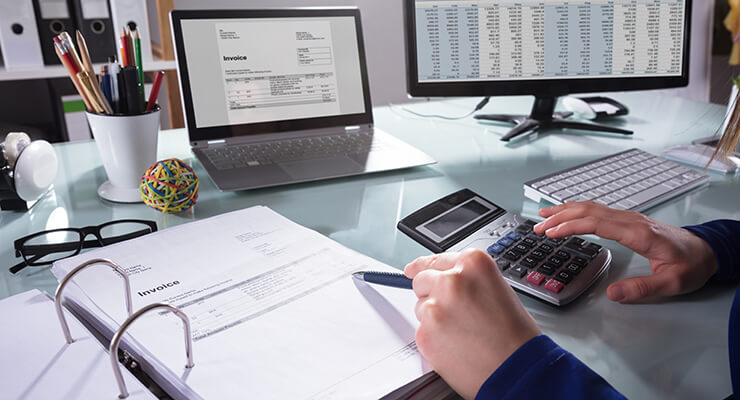 Using a calculator on a desk