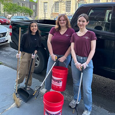 Ulster Savings employees outside with cleaning supplies