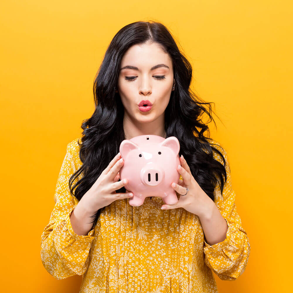 Woman holding piggy bank